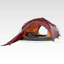 The Free Spirits Whisperwind S red flysheet over the orange inner tent, front opening revealed, studio background.