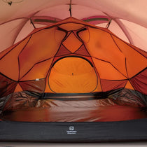 The Free Spirits Whisperwind S orange inner tent interior, breathable mesh ceiling and warm orange walls for two, floor logo.