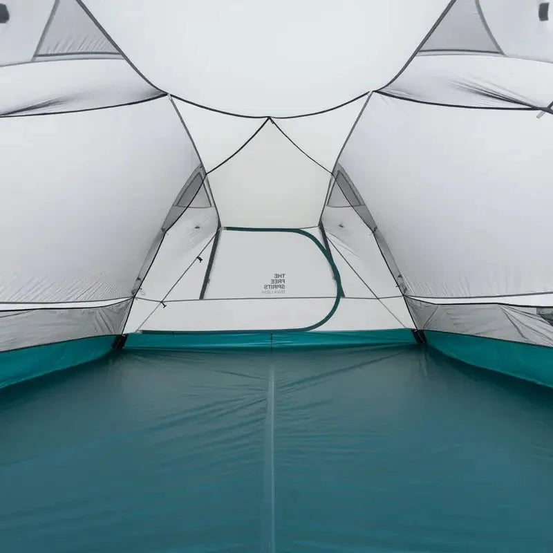 TFS Stars 4 tent in Dawn White, interior looking up at the white rainfly ceiling and teal waterproof floor.